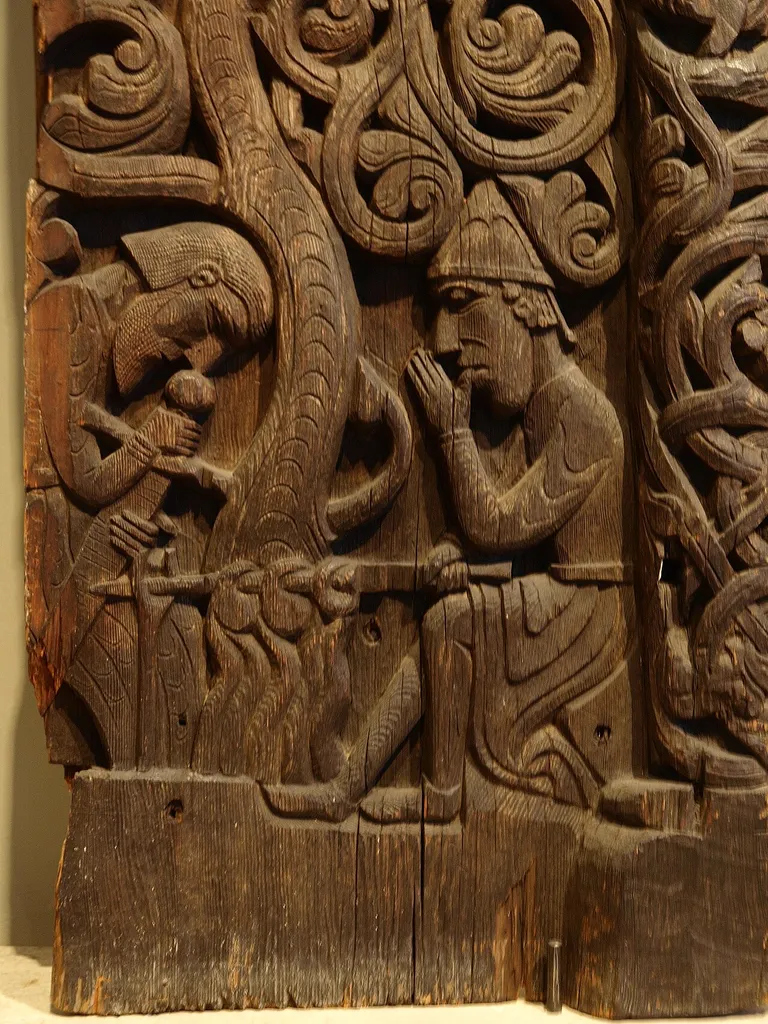 Norse hero Sigurd sucking his thumb, from the door panels of the Hylestad stave church, now at the Historisk Museum, Oslo, Norway