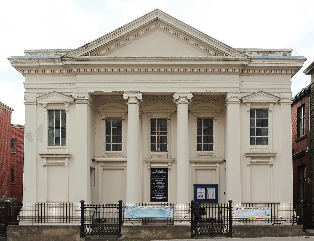 Grade II listed Presbyterian church, 1864, by Michael Gummow of Wrexham wuth stucco front, brick sides and rear, grey slate roof. Front elevation across City Road.