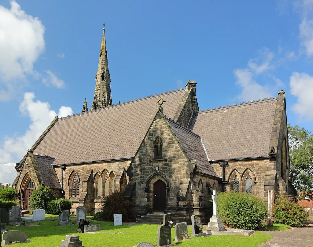 Grade II listed church on Upton Road, Moreton, 1862-3, by Cunningham and Audsley. Seen from the southwest corner of the churchyard.