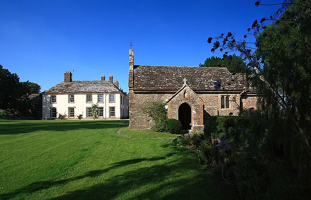 Stock House and St Barnabas' parish church, Stock Gaylard, Dorset, seen from the south