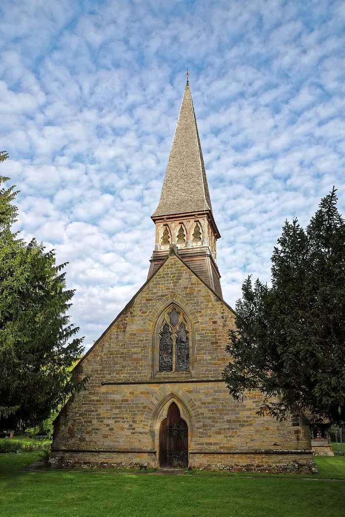 The west of the nave and the 1856-57 shingle and weatherboard bell turret (with one bell dated 1661, and two 1719), of the Grade II listed St Andrew's Church on Nuthurst Street (aka Harriots Hill) in the village of Nuthurst, West Sussex, England.Camera: Canon EOS 6D Mark II with Canon EF 24-105mm F4L IS USM lens.Software: File lens-corrected, optimized, perhaps cropped, with DxO OpticsPro 11 Elite, and likely further optimized with Adobe Photoshop CS2.