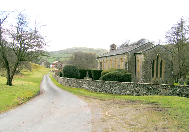 View southwest past Holy Trinity parish church, Howgill, Cumbria, toward Thwaite. This view is in the opposite direction from 150938.