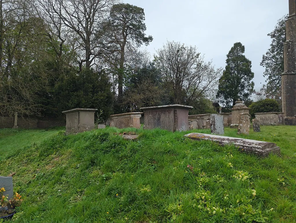 Group Of Three Chest Tombs Standing On The South Side Of The Footpath To The South Of The South Aisle Of The Church Of St Michael (chest tomb in Kington St. Michael, Wiltshire, England, UK)