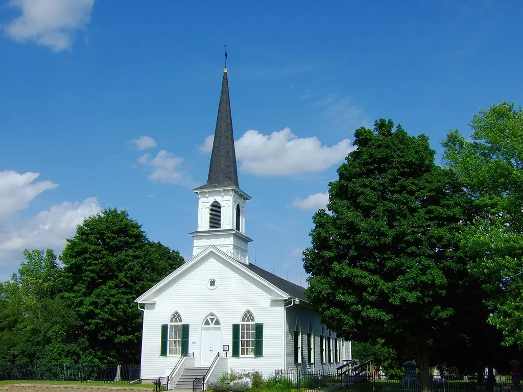 First Lutheran Church at the intersection of Old Sauk and Pleasant View Roads in Middleton, Wisconsin, was added to the National Register of Historic Places in 1988. German immigrants who came to the Middleton area in the 1840s formed a Lutheran congregation in 1852. In 1854, they built a log church just north of the present edifice. in 1866, a second church was built, this time with sawn lumber as well as a steeple and bell. In 1884, an addition was built including a new steeple and bell. The edifice served until 1947, when regular services were discontinued and the congregation dissolved. A dedicated group of volunteers maintains the sanctuary and the surrounding cemetery. A memorial service is held annually in the late summer to honor "the big church on the hill" founded by early settlers.