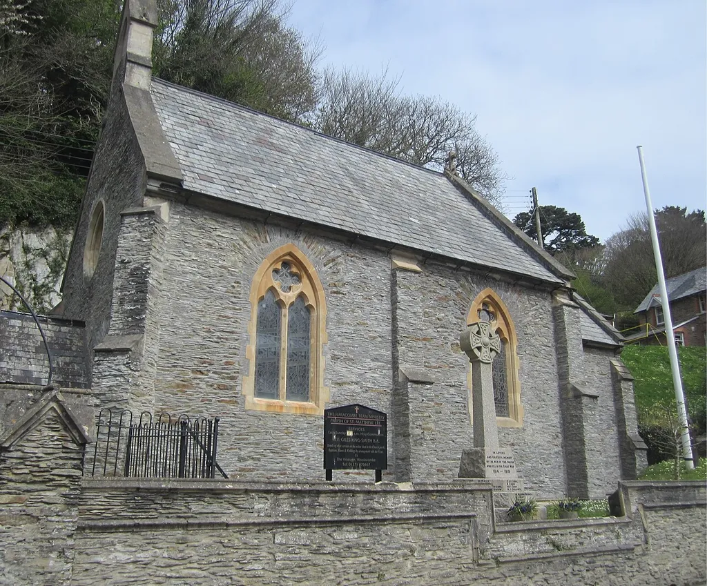 Parish church of St Matthew, Lee, Devon, seen from the south, with the parish war memorial in front